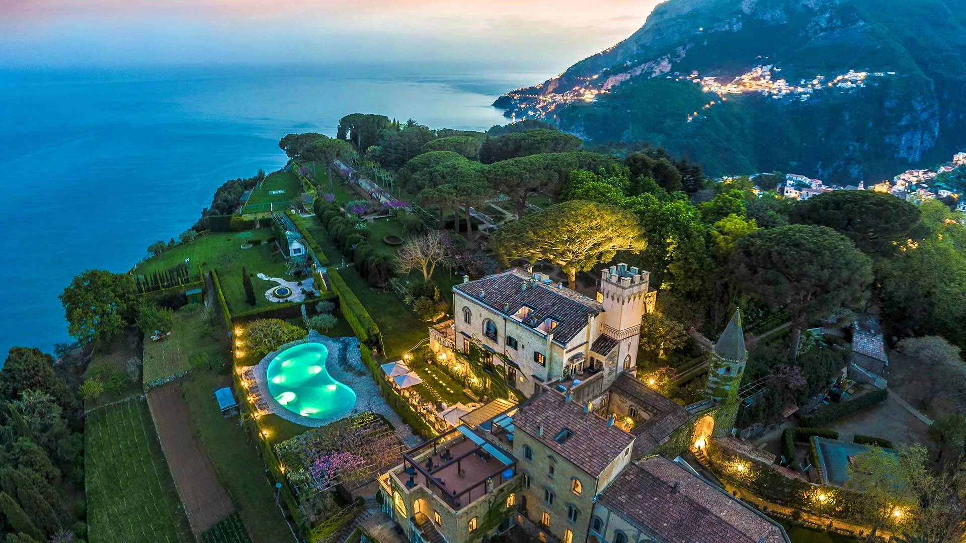 Hotel Villa Cimbrone in Ravello at twilight: the villa, gardens and cliff above the coast