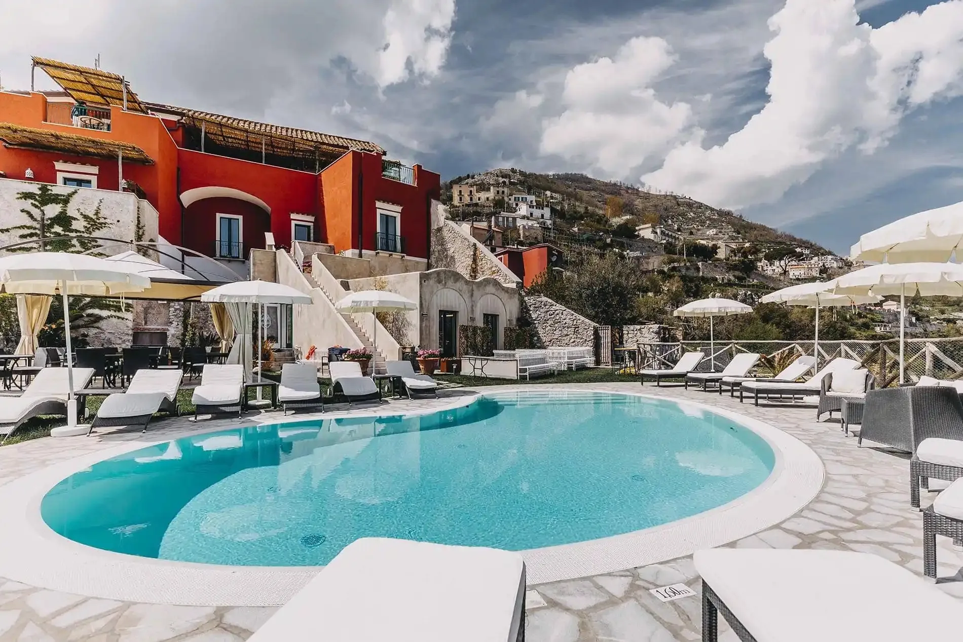 Palazzo Pascal in Scala: the terracotta palazzo, pool terrace and hillside