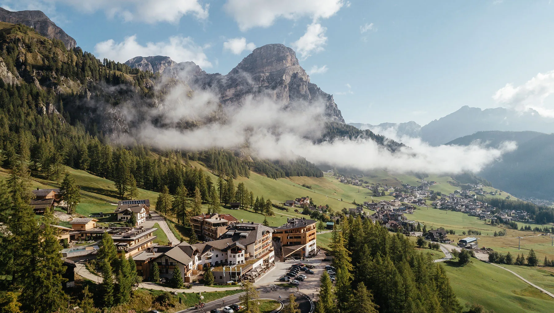 Kolfuschgerhof Mountain Resort in Colfosco, Alta Badia: the hotel in the valley below Col Pradat