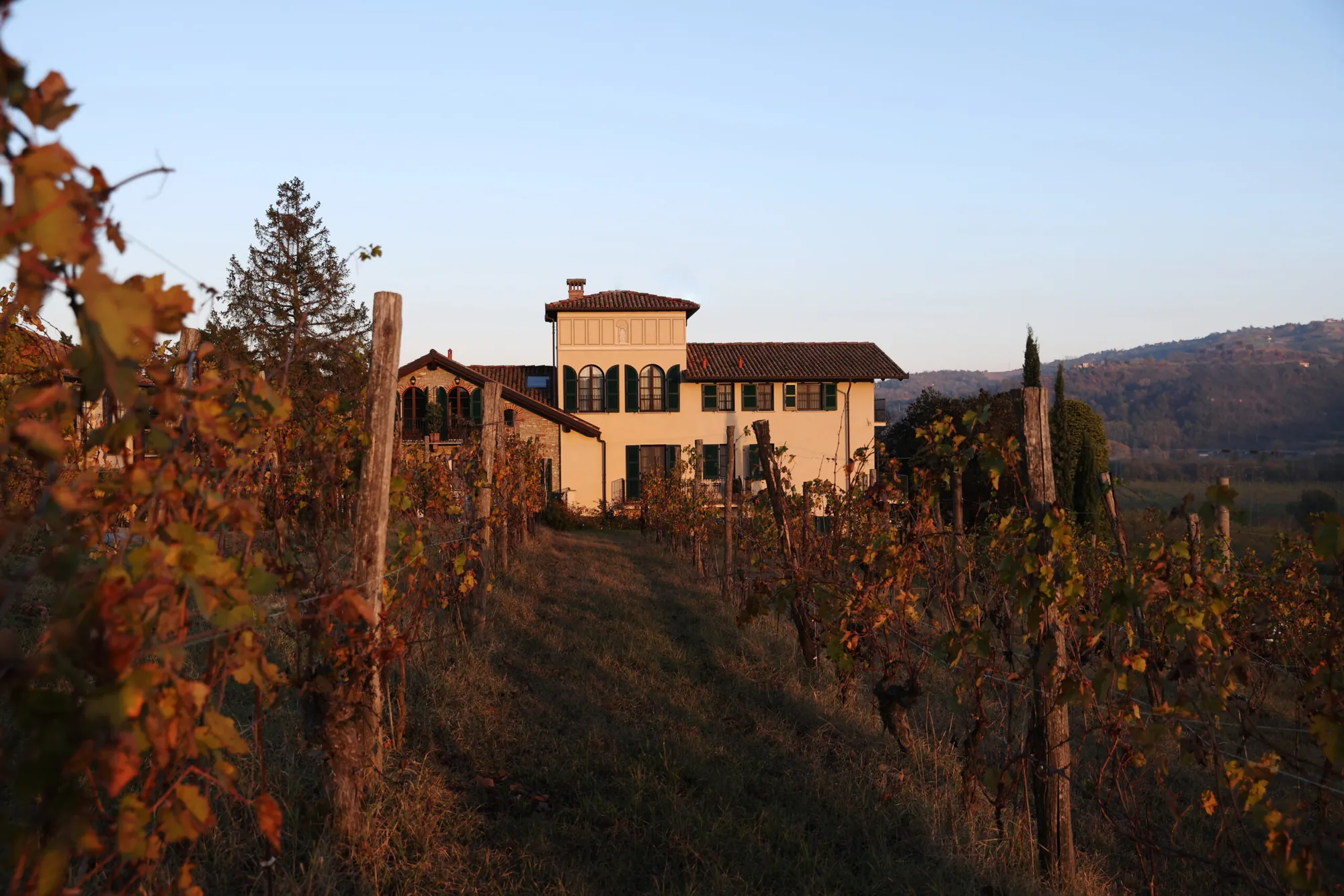 Villa La Madonna among the autumn vines of Monastero Bormida.