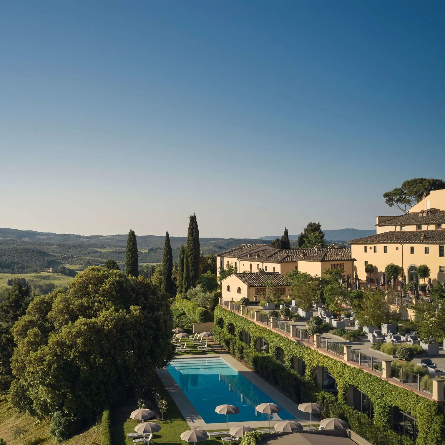 COMO Castello Del Nero: terraces, pool and the Chianti landscape